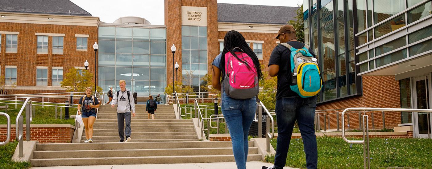 Students walk to and from class outside of the Compton Science Center